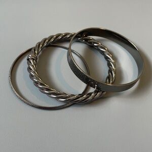 Three different gunmetal colored bangles